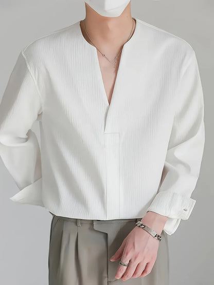 Homixa men's solid color V-neck long sleeve Henley shirt displayed flat with buttons and ribbed cuffs, casual and versatile style.
