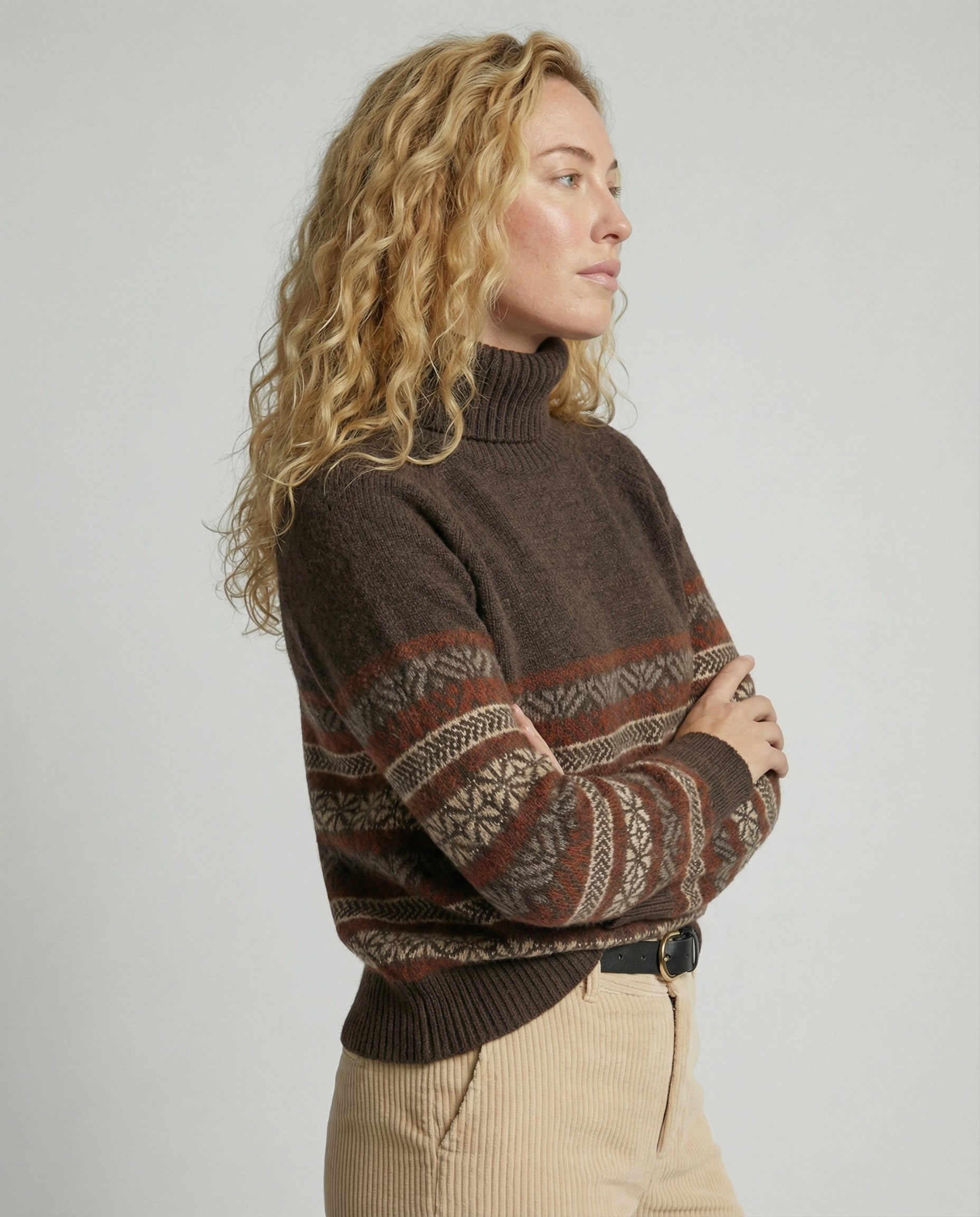 Back view of a Homixa women's sweater from the Everyday Layer Lily Edit, featuring a cozy knit design in a neutral color.