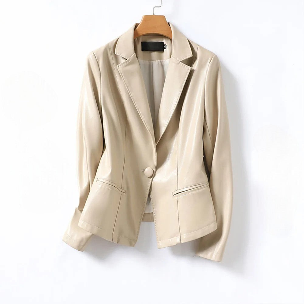 Beige Vera Lambskin Leather Blazer by Jack Hafford displayed on a hanger, showcasing its sleek design and soft leather texture.