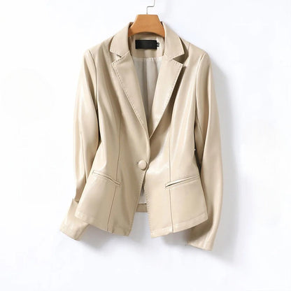 Beige Vera Lambskin Leather Blazer by Jack Hafford displayed on a hanger, showcasing its sleek design and soft leather texture.