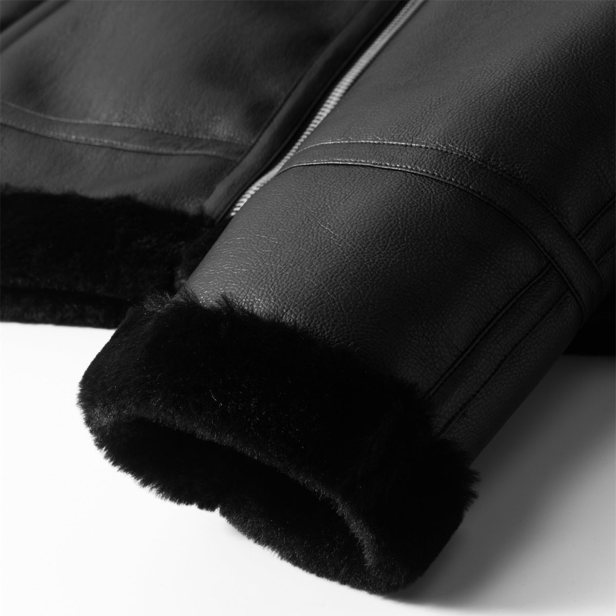 Close-up of black Travis leather jacket by Jack Hafford, showing detailed stitching and smooth leather texture.