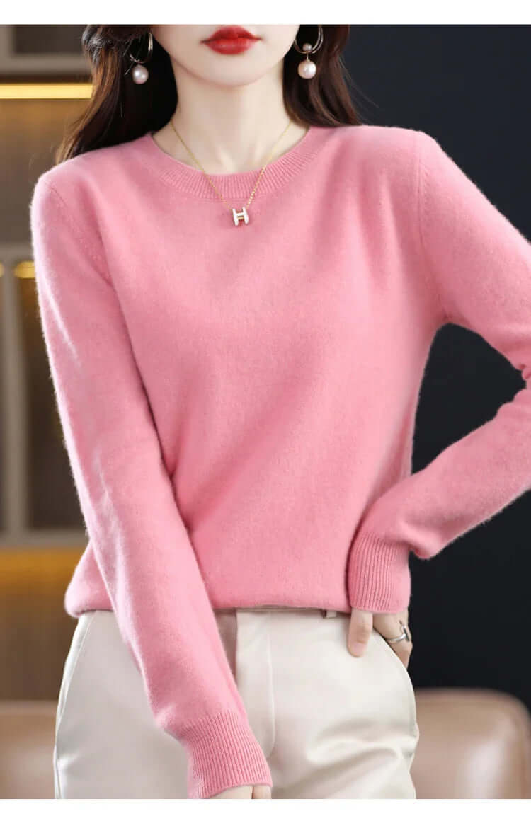 Homixa Belvia women's fine-knit crew-neck sweater with ribbed cuffs and solid color finish, displayed on a model.