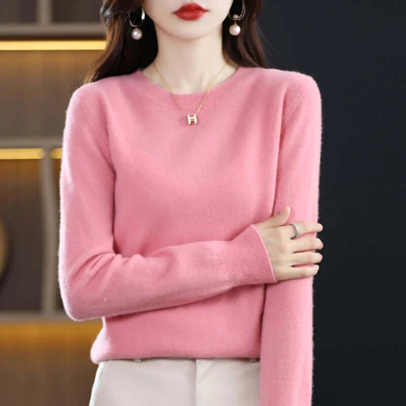 Homixa Belvia women's fine-knit crew-neck sweater with ribbed cuffs and solid color finish, shown in a close-up view.
