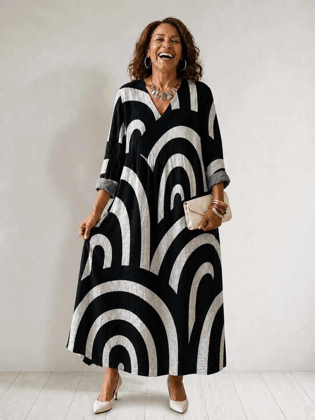 Women's geometric-print V-neck maxi dress by Homixa featuring a flowing silhouette and vibrant pattern.