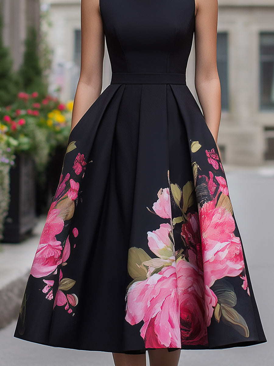 Black floral A-line midi cocktail dress for women by Kate and Wendy, featuring a fitted bodice and flowy skirt.