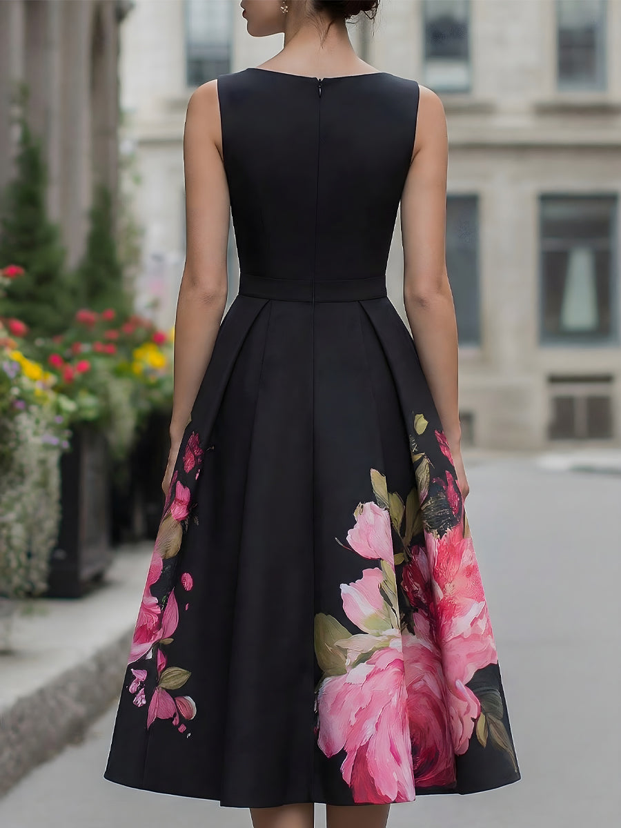 Black floral A-line midi cocktail dress for women by Kate and Wendy, shown on a model with elegant design and fitted waist.