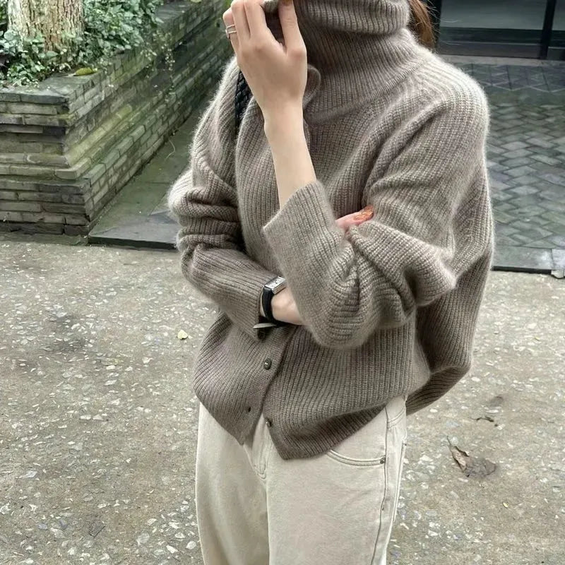 Homixa Alondra women's relaxed soft-knit turtleneck sweater with button details, shown in a cozy, casual fit.