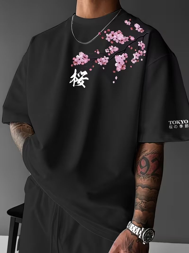 Homixa Hiro men's cotton T-shirt with cherry blossom print, crew neck, and relaxed fit, shown with adjustable strap sandals.
