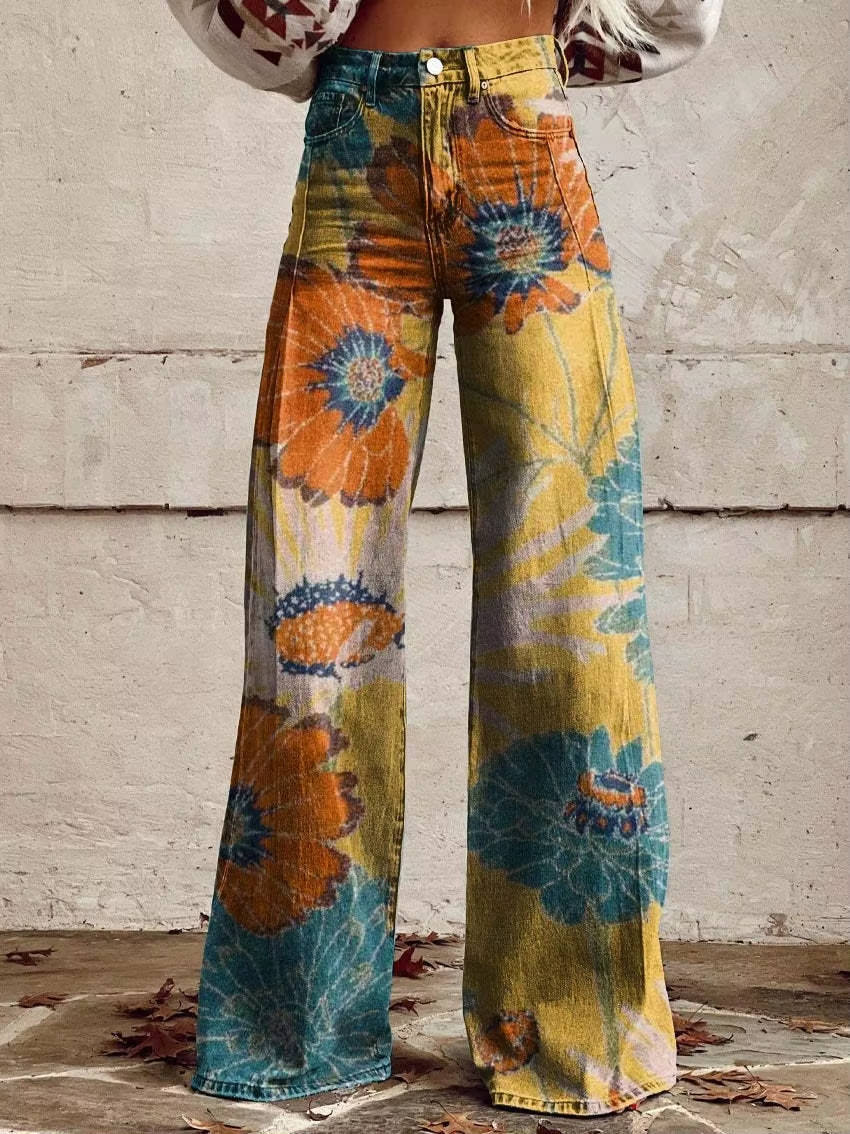 Homixa Delrielle high-waisted floral bell-bottom trousers with belt loops and stretch fabric, displayed on a hanger.