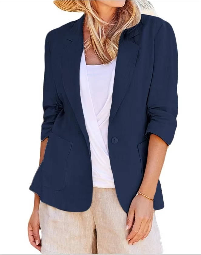 Homixa Belrielle women's linen blazer with ruched three-quarter sleeves and patch pockets, styled on a model.