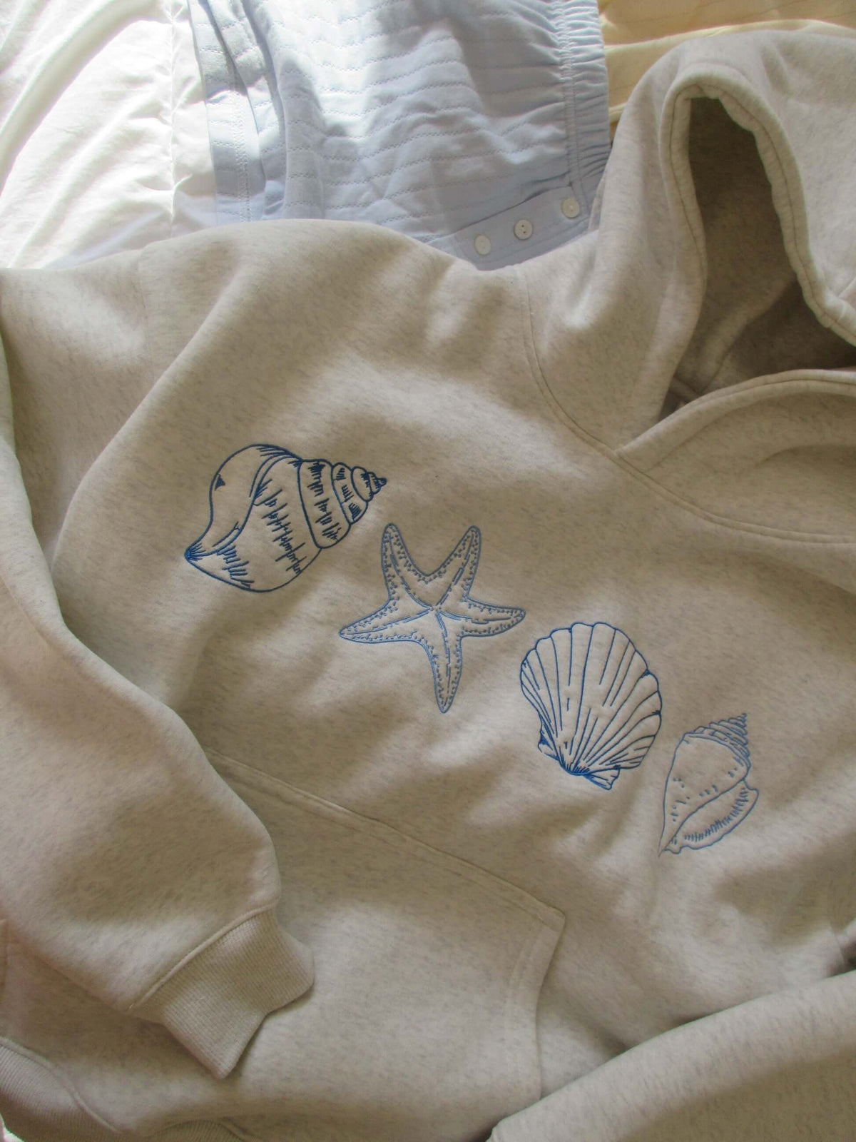 Women's hoodie by Lunirel featuring a seashell print, with a cozy fit and casual style, perfect for everyday wear.