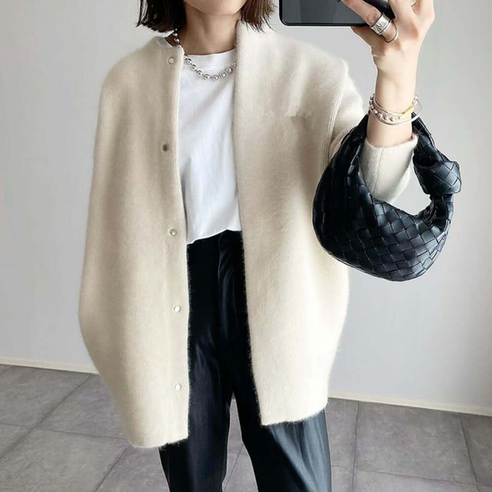 Women's elegant knit cardigan from Lunirel, featuring a cozy hood and stylish design, perfect for casual or layered outfits.