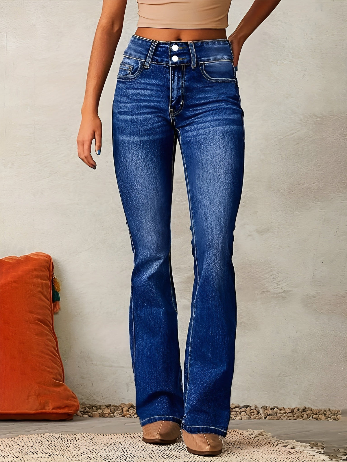 Homixa Alana flared jeans with double-button waist, washed finish, contrast stitching, and a comfortable fit on a model.