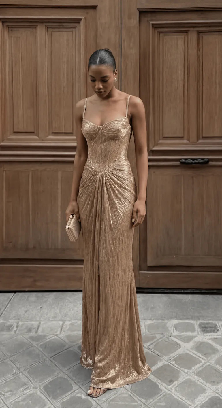Elegant women's gold ruched corset maxi dress by Homixa, featuring a fitted bodice and flowing skirt, perfect for formal occasions.