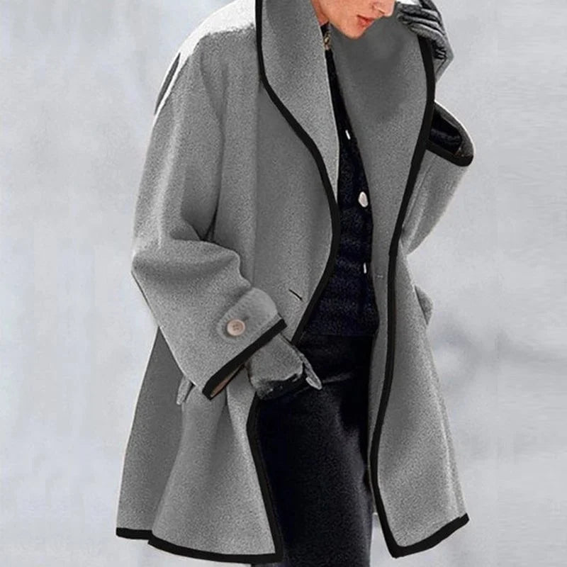 Homixa Agnes women's merino wool trench coat in gray with a statement collar, contrast trim, and buttoned cuffs.