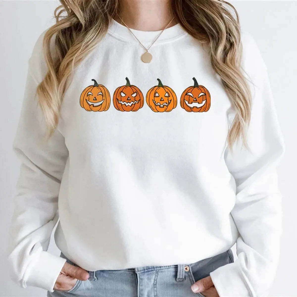 Women's Halloween sweatshirt by Homixa featuring a festive Jack-o-Lantern graphic on a cozy crewneck sweatshirt.