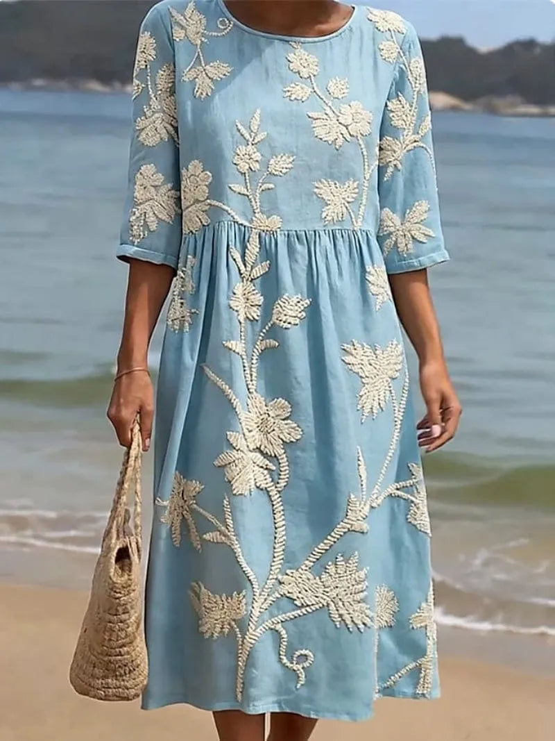 Homixa Flora women's embroidered maxi dress featuring intricate floral embroidery and flowing fabric, perfect for summer wear.