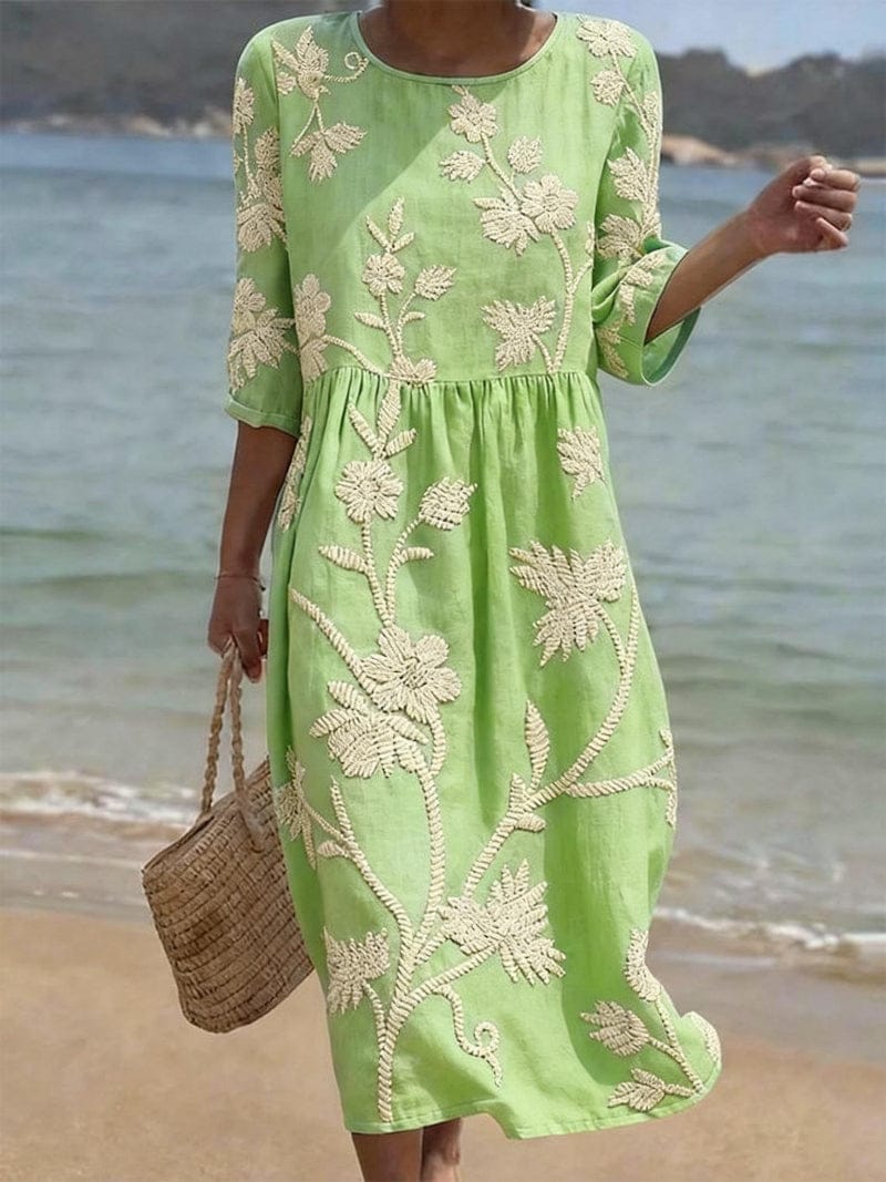 Homixa Flora women's embroidered maxi dress with intricate floral embroidery, flowing fabric, and elegant design.