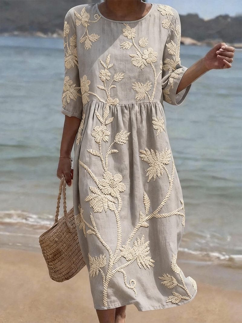Homixa Flora women's embroidered maxi dress featuring intricate floral embroidery and flowing fabric, perfect for elegant occasions.