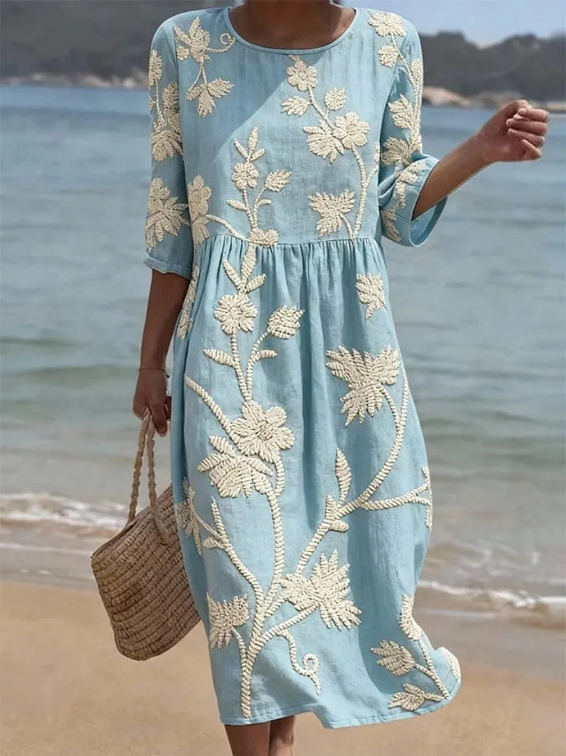 Homixa Flora women's embroidered maxi dress with intricate floral embroidery and flowing fabric, perfect for elegant summer wear.