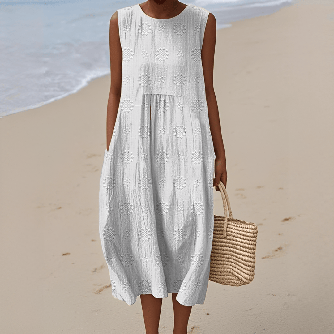 Light beige women's sleeveless summer midi dress with side pockets, casual style perfect for everyday wear and warm weather.