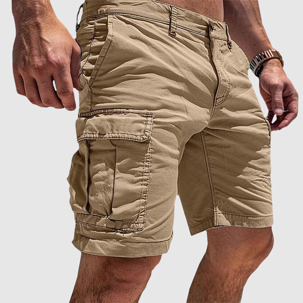 Homixa Hudson men's utility cargo shorts showing multiple pockets and durable fabric in a casual outdoor setting.