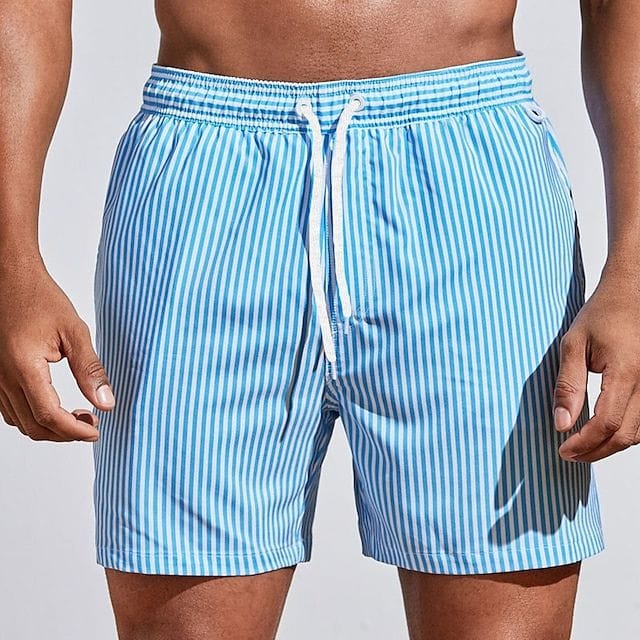Homixa Kai men's drawstring swim shorts with adjustable waistband and quick-dry fabric, shown hanging on a plain background.