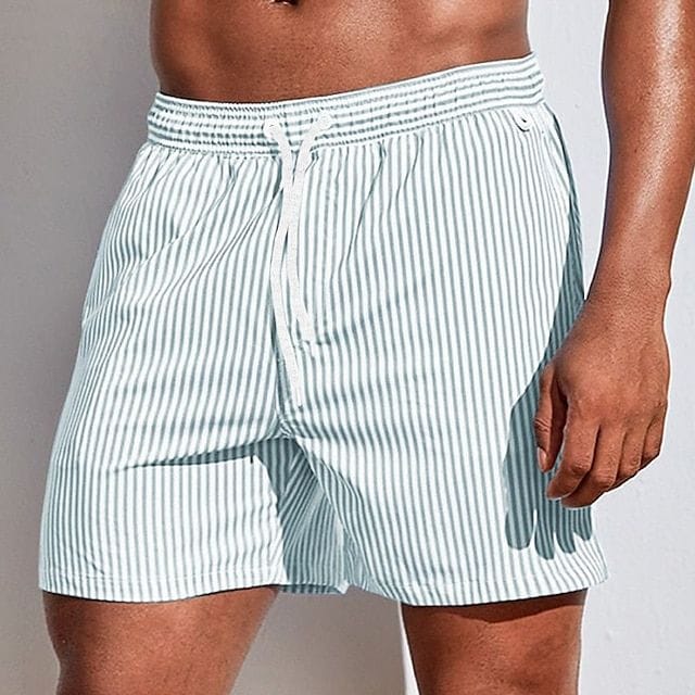 Homixa Kai men's drawstring swim shorts with adjustable waistband and vibrant blue pattern, suitable for beach and pool wear.