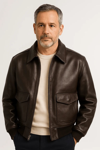 Unisex leather jacket from Homixa featuring a layered style, shown in a close-up of the black leather with detailed stitching.
