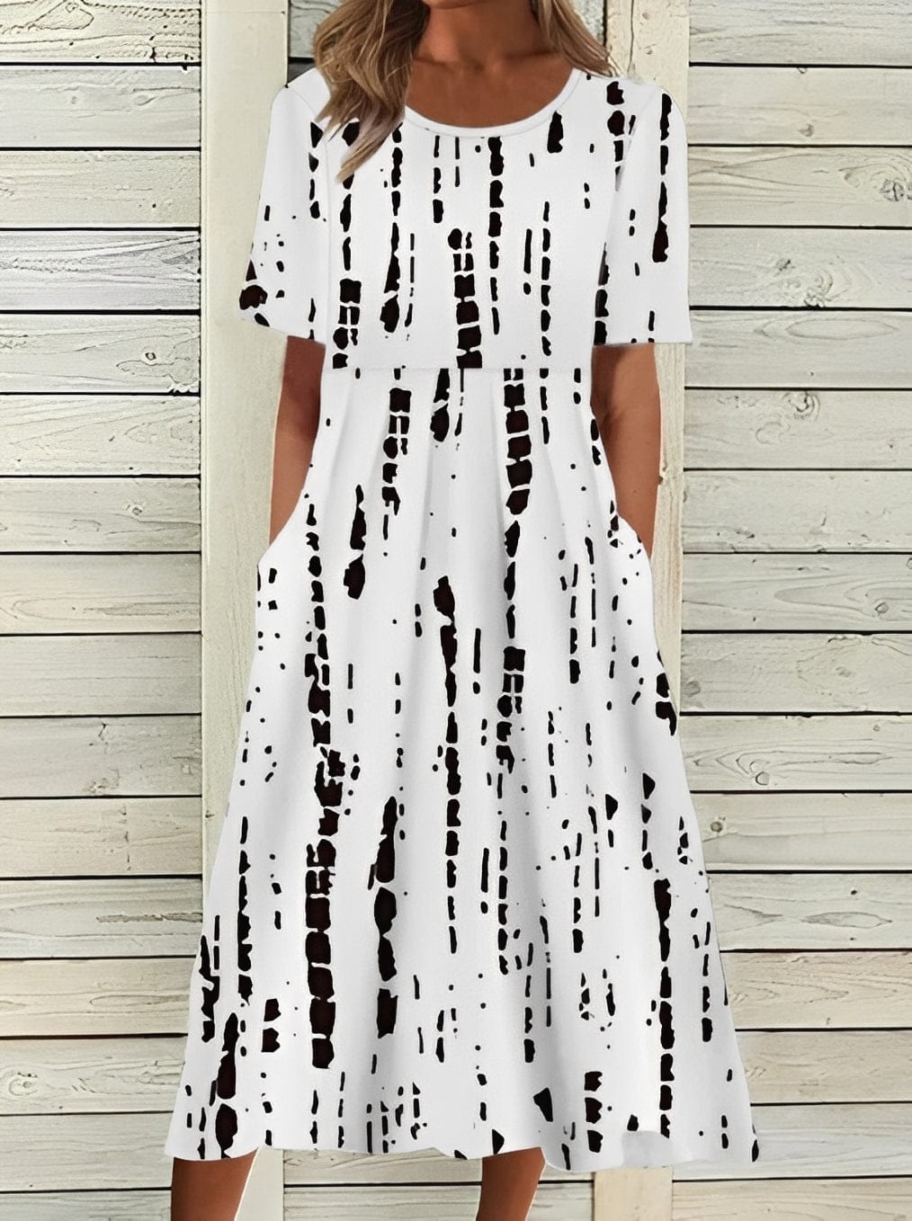Elegant women's midi dress by Mainz-Mode featuring a floral design and flowing silhouette, perfect for stylish occasions.