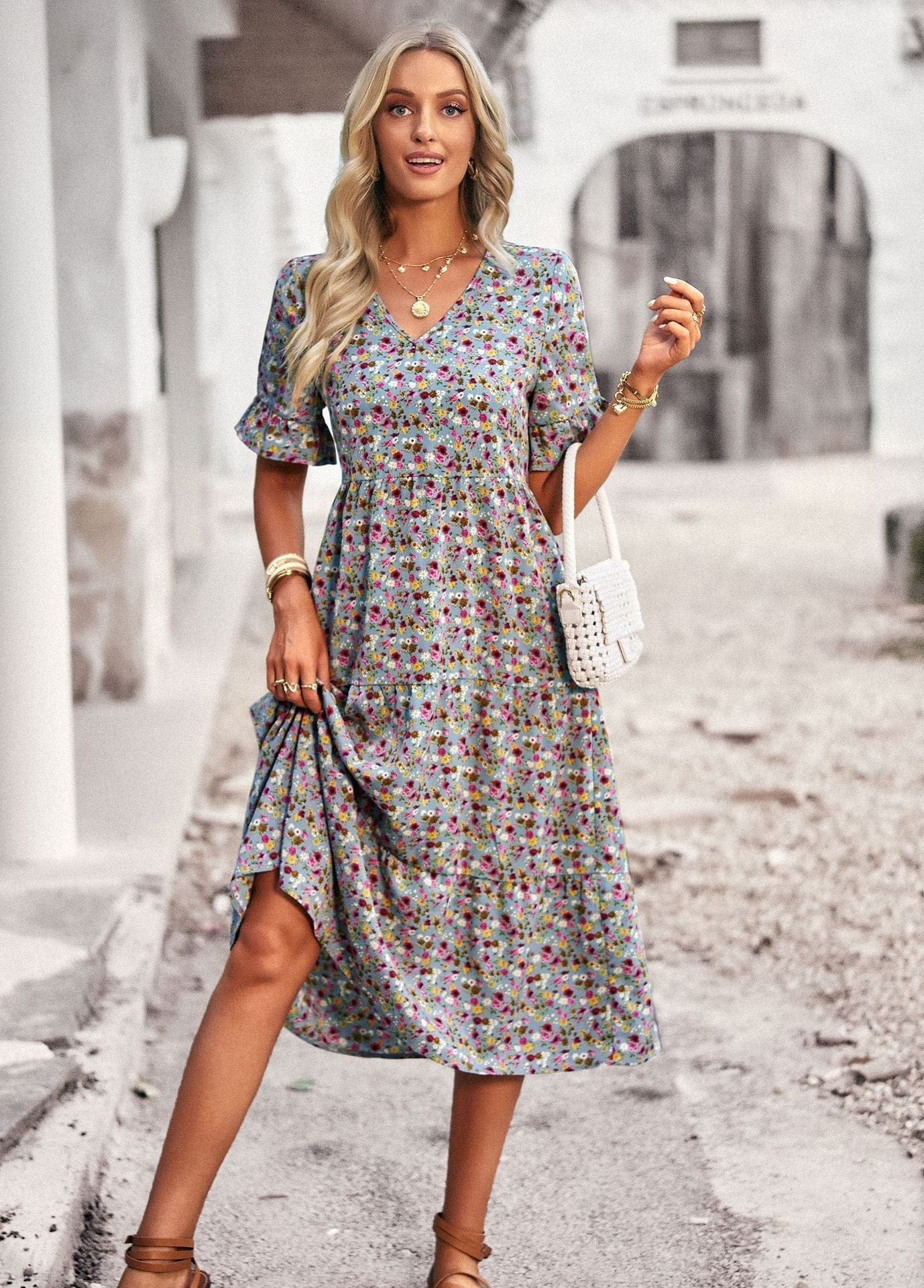 Women’s floral midi dress by Mainz-Mode featuring a comfortable fit, displayed on a model with a relaxed, elegant style.