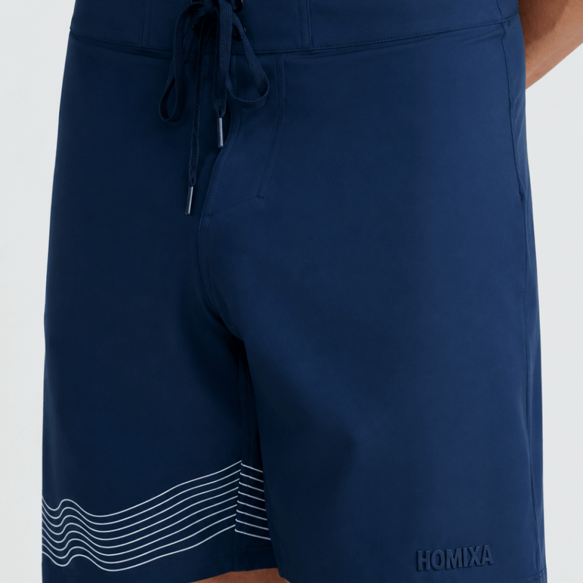 Homixa Wave men's navy blue boardshorts displayed flat with elastic waistband and drawstring, suitable for swimming and beachwear.