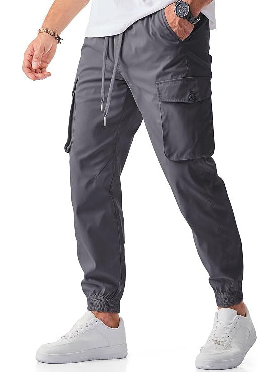 Homixa Belvora men's cargo joggers with drawstring waist, flap pockets, and tapered cuffs, shown in a relaxed fit style.