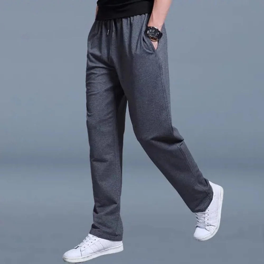 Homixa Belthia men's cotton sweatpants with straight legs, side pockets, and drawstring waist, shown on a model.