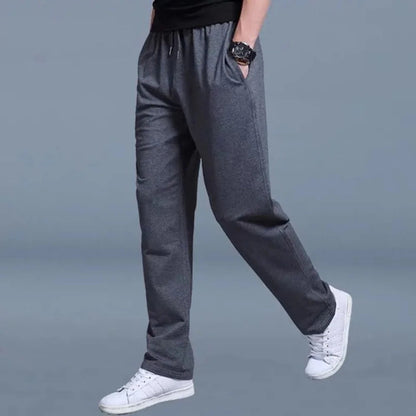 Homixa Belthia men's cotton sweatpants with straight legs, side pockets, and drawstring waist, shown on a model.