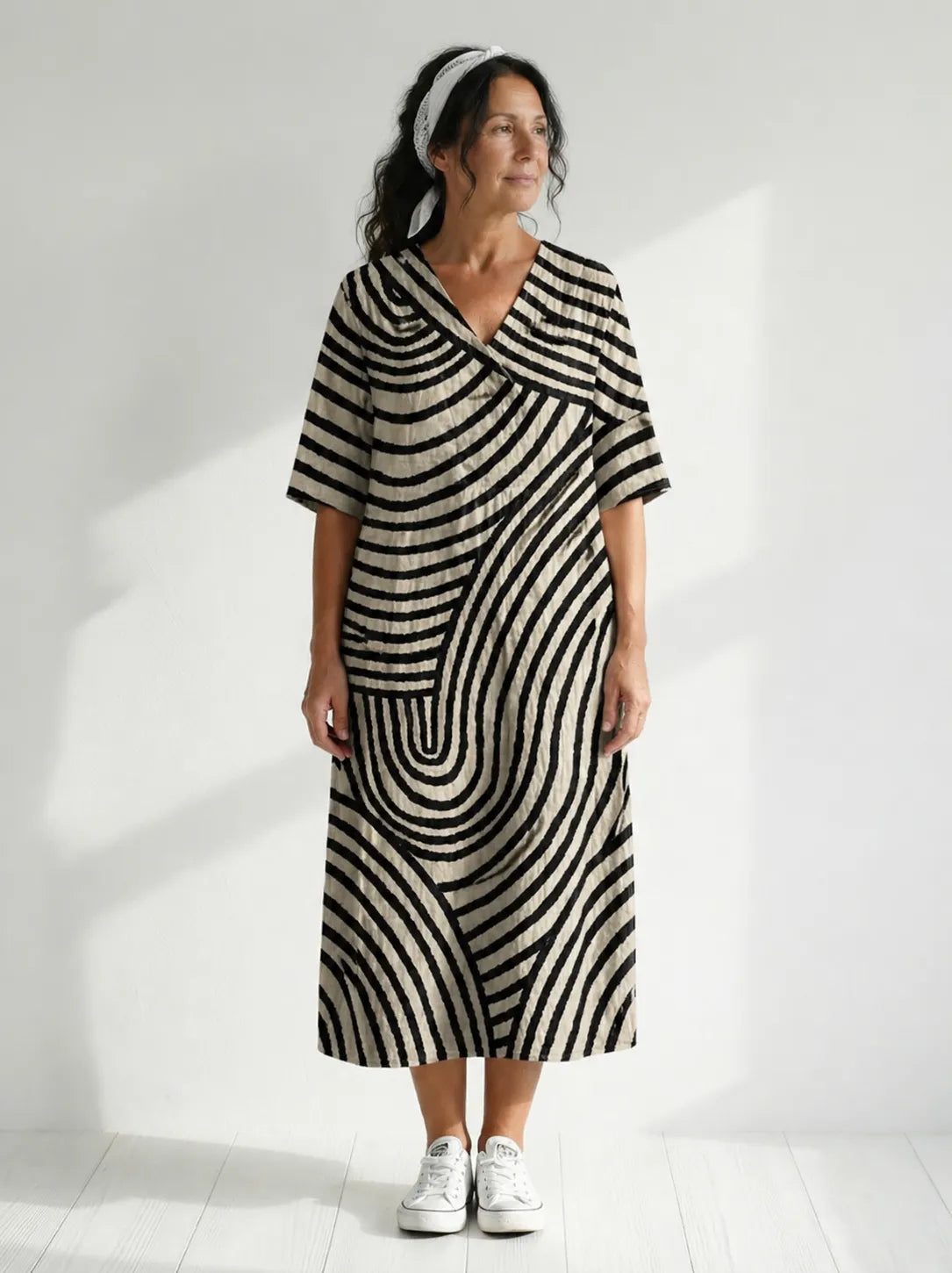 Homixa women's graphic-print V-neck midi dress displayed on a model, featuring a stylish, flowy design ideal for casual wear.