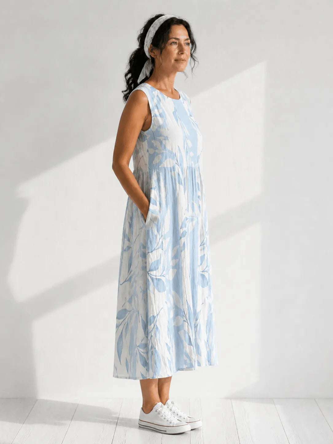 Women's leaf-print sleeveless midi dress by Homixa featuring a pocket and flowy design, perfect for casual or summer wear.