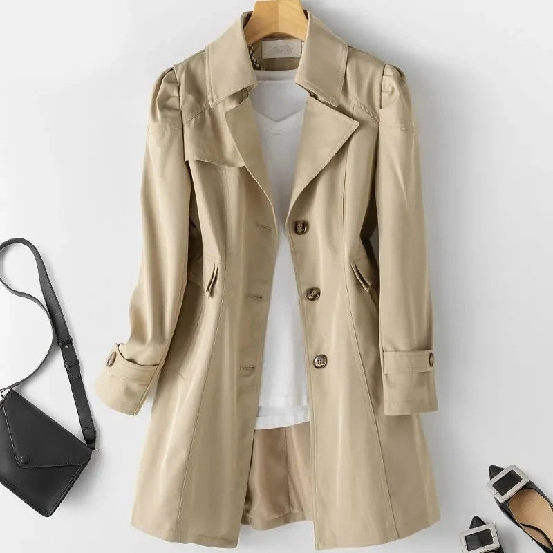 Khaki Jack Hafford Novelle trench coat displayed on a hanger, showcasing sleek design and classic silhouette for stylish outerwear.