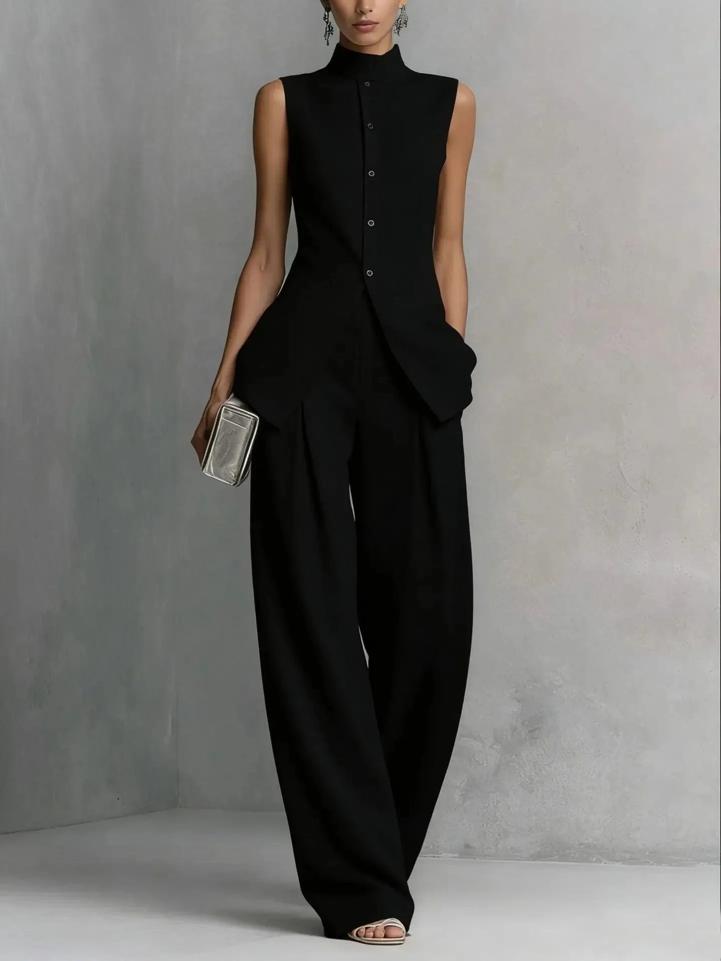 Women's sleeveless stand-collar peplum pant set by Homixa, featuring a stylish two-piece design with a fitted top and matching pants.