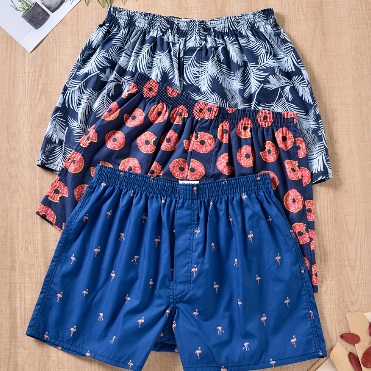 Homixa men's 3-pack plant-print cotton boxer shorts featuring a gathered waistband and loose legs for comfortable, breathable wear.