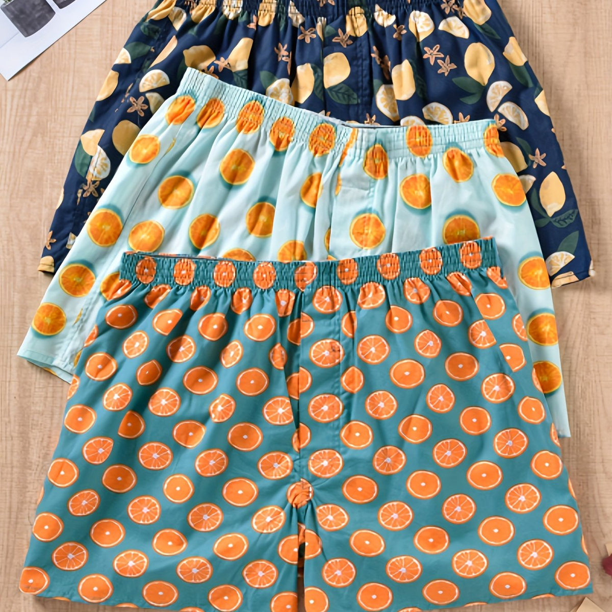 Homixa Avethia men's 3-pack cotton boxer shorts with green plant print, gathered waistband, and loose legs for comfort and style.