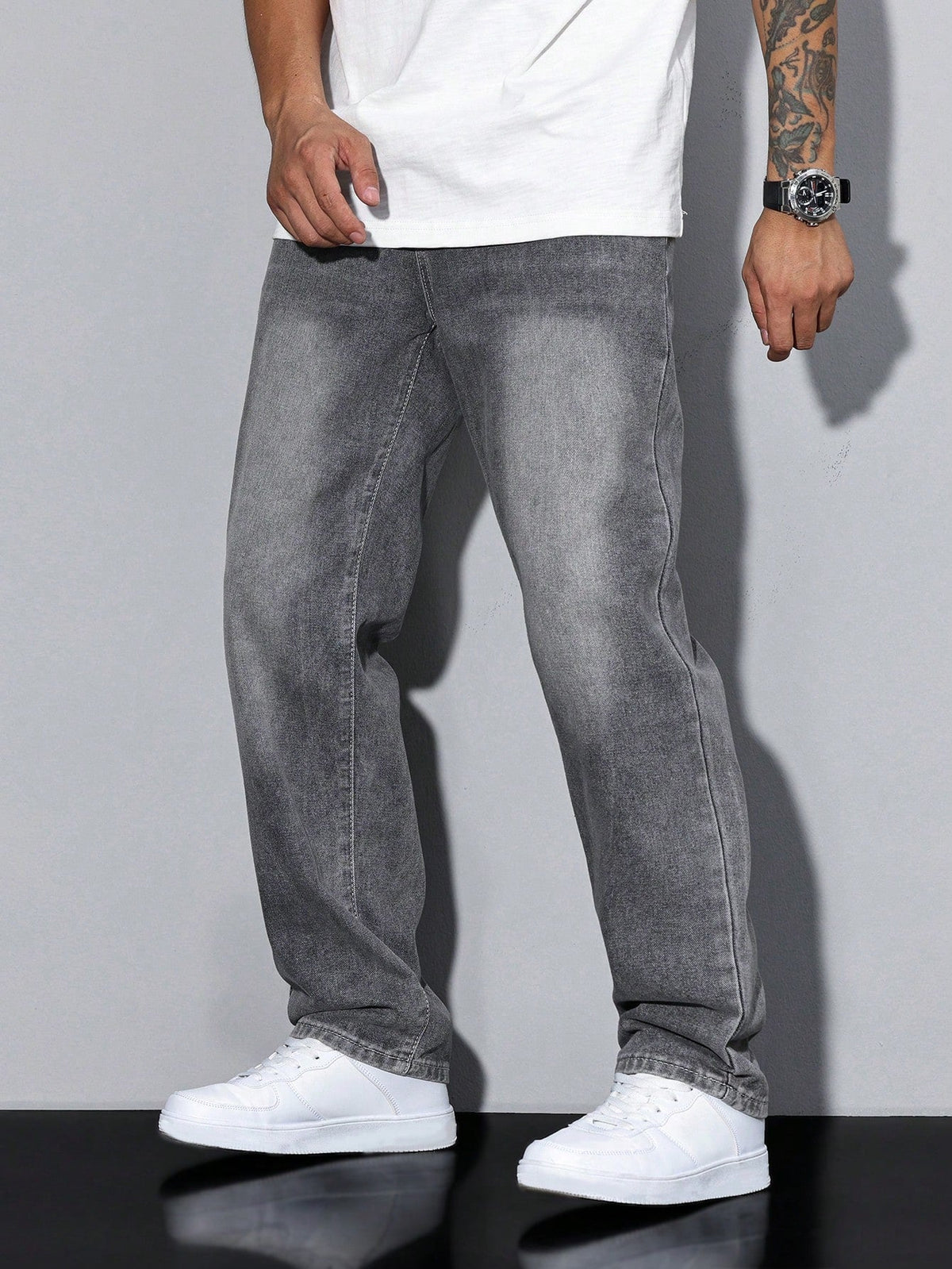 Men's baggy denim jeans by Kate and Wendy featuring a zip fly and five-pocket design, shown on a model.