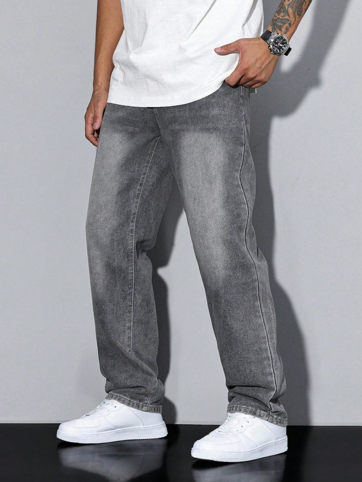 Men's baggy denim jeans by Kate and Wendy with zip fly and five-pocket design, showcased on a model.