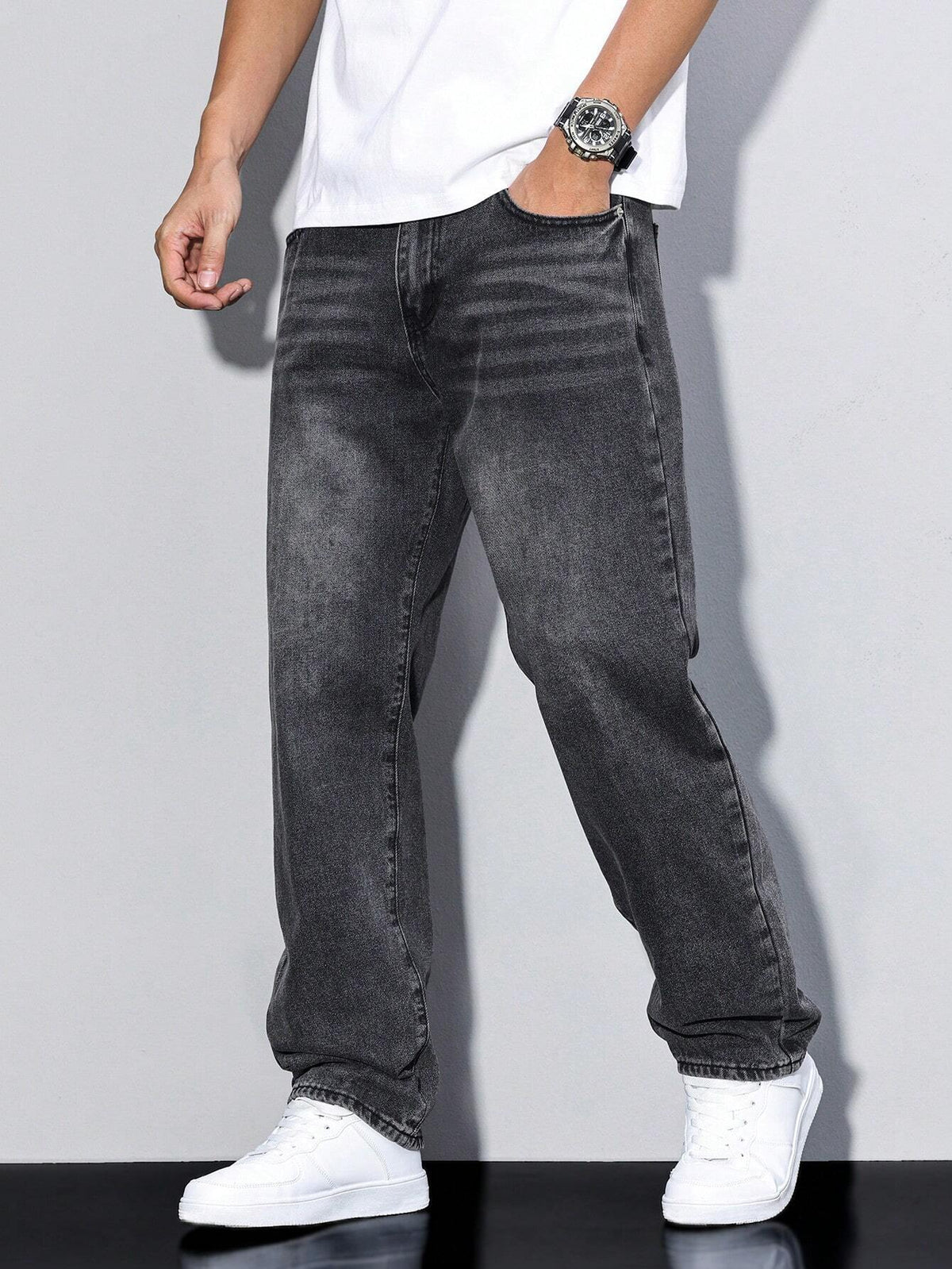 Men's baggy denim jeans by Kate and Wendy featuring a zip fly and five pockets, displayed on a male model.