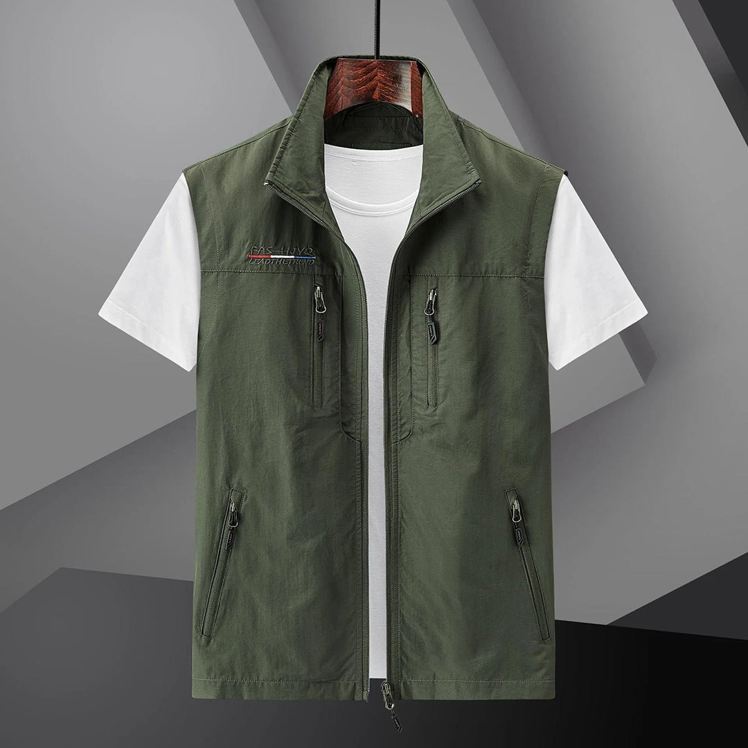 Men's casual utility vest by Homixa with multiple functional pockets and a relaxed fit, shown in a neutral color.