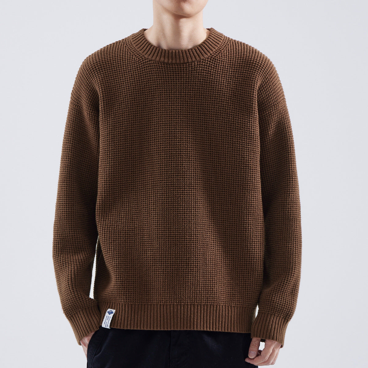 Men's Homixa crew-neck sweater with fine texture, ribbed collar, cuffs, and hem, showcasing a stylish and comfortable knit design.