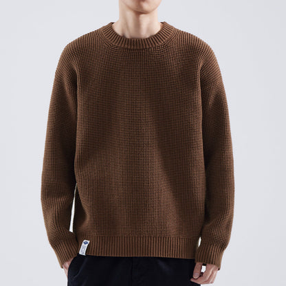Men's Homixa crew-neck sweater with fine texture, ribbed collar, cuffs, and hem, showcasing a stylish and comfortable knit design.