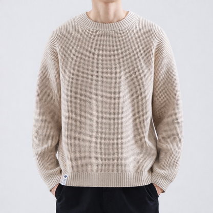 Men's fine-textured crew-neck sweater by Homixa with ribbed collar, cuffs, and hem, shown in a close-up view.