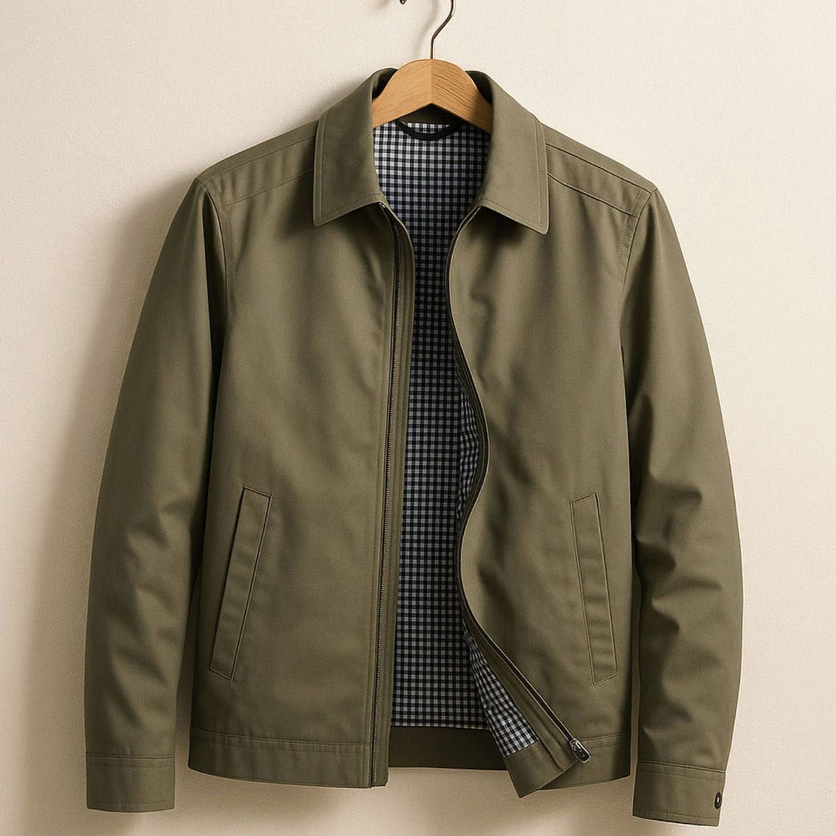 Men's Homixa Harrington bomber jacket with plaid lining, zip front, and angled pockets, displayed on a model.