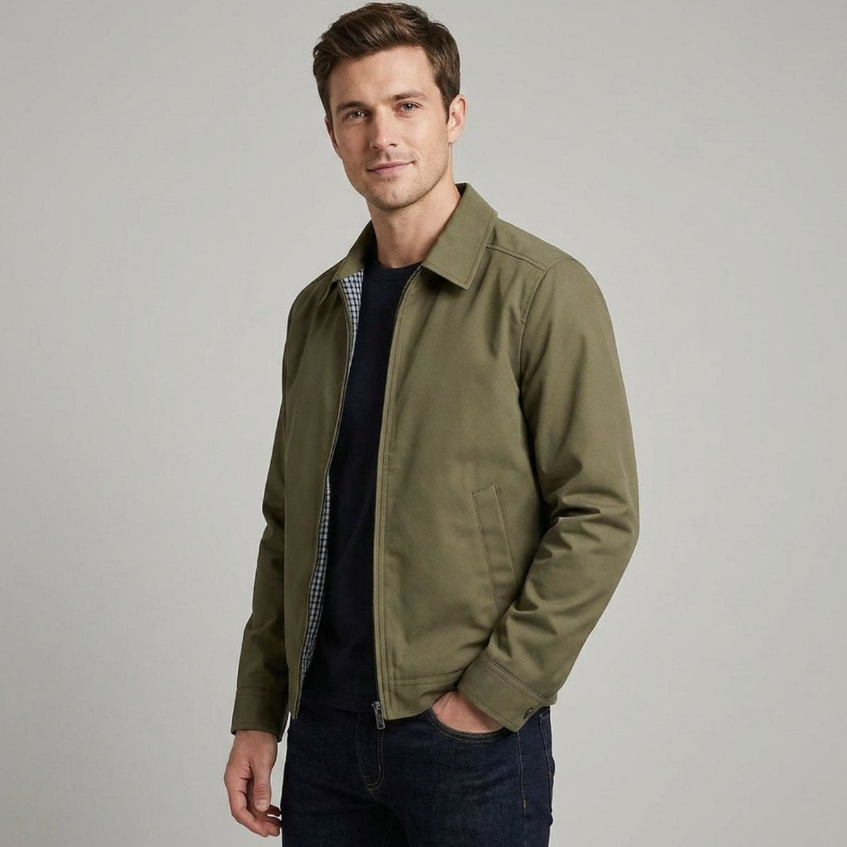 Men's Homixa Harrington bomber jacket with plaid lining, zip front, and angled pockets, shown on a model.
